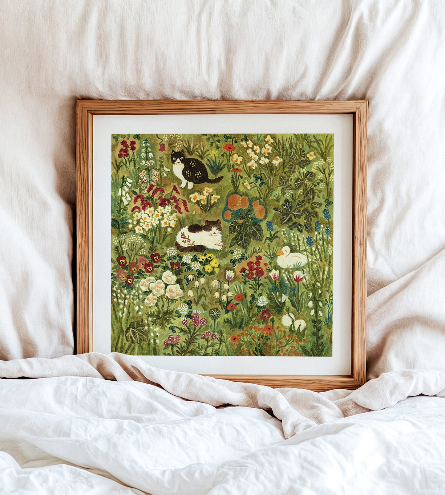 Two Cats and a Duck in the Garden