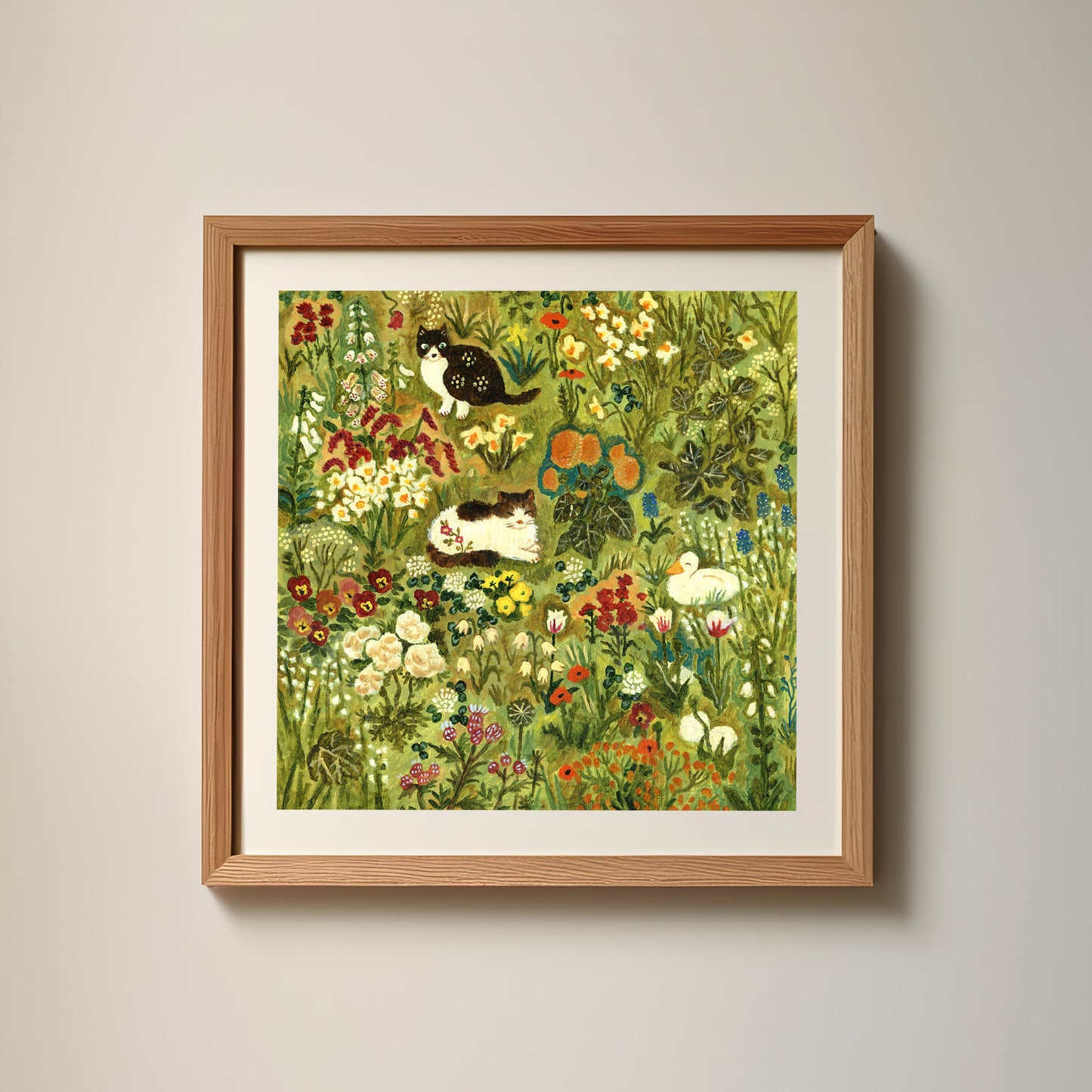 Two Cats and a Duck in the Garden