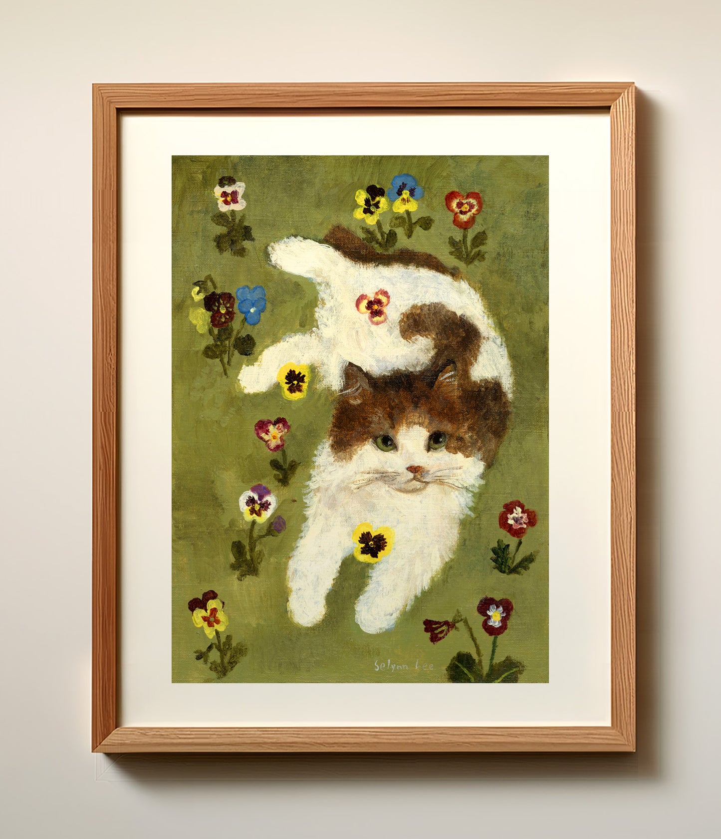 A cat and pansy flowers